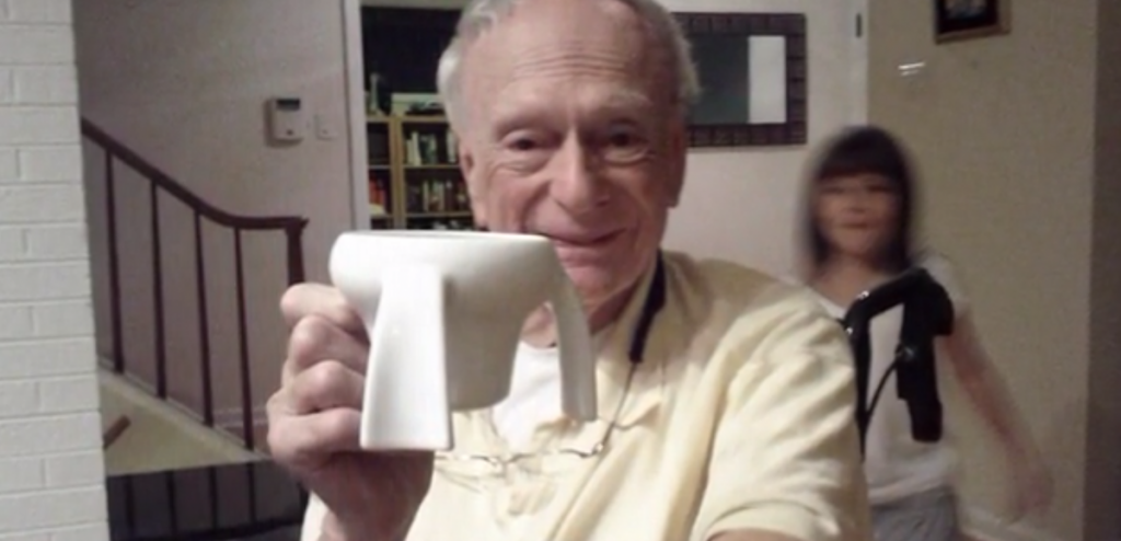 Young Girl Invents Cup for Her Grandfather with Parkinson' class=